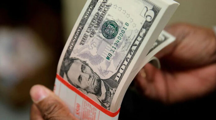 Dollar touches 20-year high, but kept in check by euro, as rates in focus